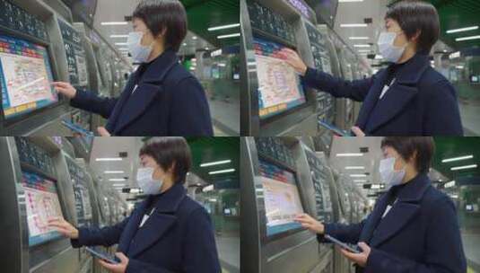 使用自动购票机买车票的亚洲女性高清在线视频素材下载