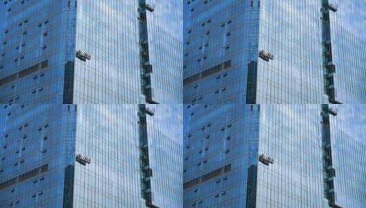 城市高楼玻璃幕墙安装高空作业高清在线视频素材下载