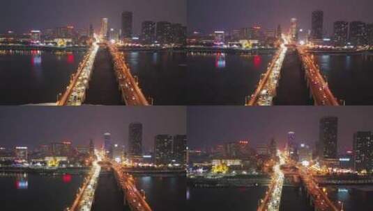 航拍吉林市松花江上夜色中的吉林大桥高清在线视频素材下载
