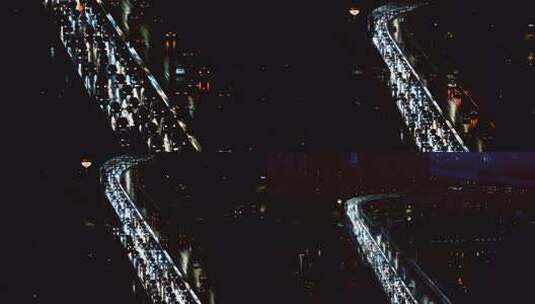 雨夜城市高楼间繁忙的公路车流高清在线视频素材下载