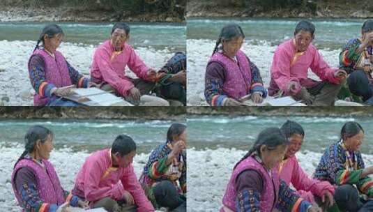 藏族妇女纺线织布男子喝酥油茶劳作生活高清在线视频素材下载