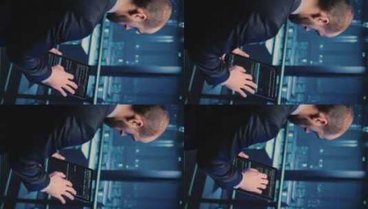 现代机房中使用平板电脑的垂直视频数据中心工程师高清在线视频素材下载