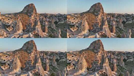 土耳其卡帕多西亚日落谷天然岩石地层与洞穴房屋的鸟瞰图高清在线视频素材下载