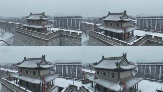 航拍陕西省西安市正在下雪的西安城墙雪景高清在线视频素材下载