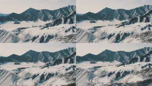 航拍特写被大雪覆盖的森林白茫茫的山峰山脉高清在线视频素材下载