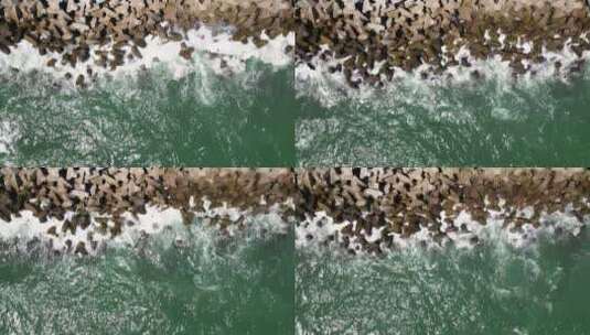 4K海浪拍打海岸的石块高清在线视频素材下载