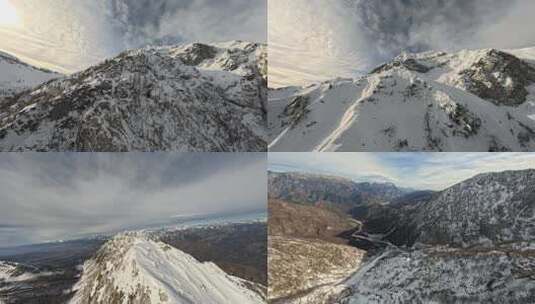 FPV无人机航拍冬日雪山雪景岩石树林风景高清在线视频素材下载