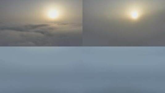 云海上的太阳及钻入云雾的航拍高清在线视频素材下载