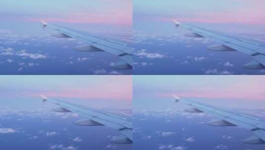 从飞机窗户看粉红色的日落高清在线视频素材下载