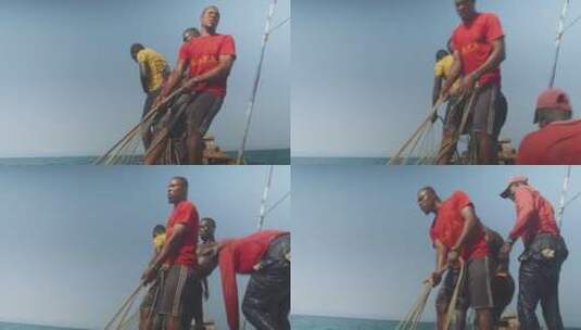 男人在船上用力拉绳索高清在线视频素材下载