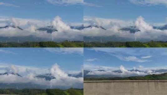 云雾缭绕高山上的高压电塔高清在线视频素材下载