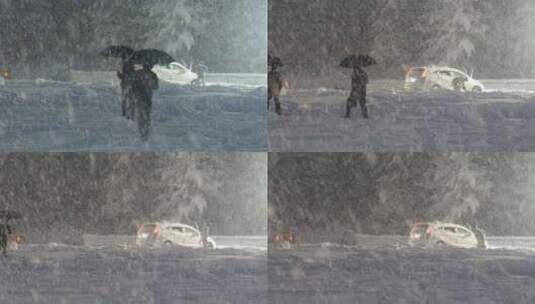 暴雪天气人们撑着伞出行高清在线视频素材下载