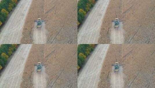 农地作业联合收割机在田间缓慢飞行的航拍高清在线视频素材下载