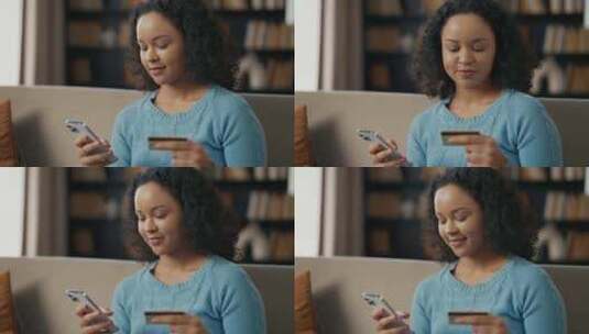 进行在线支付的非裔美国妇女年轻女孩使用信高清在线视频素材下载