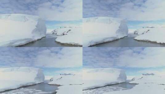 海洋通过冰山和南极洲陆地高清在线视频素材下载