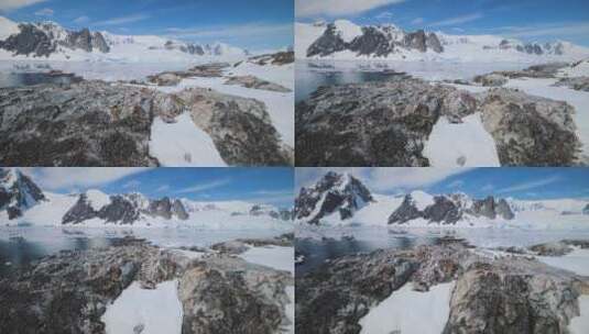 雪岩与企鹅。南极洲航拍。高清在线视频素材下载