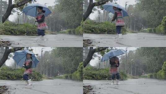 女孩在雨中的水坑里玩耍高清在线视频素材下载