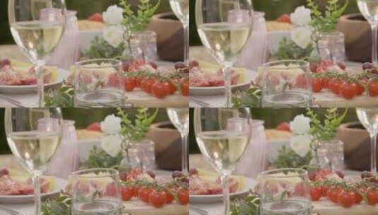 把焦点从露天餐桌上的镜头分散到一杯白葡萄酒上高清在线视频素材下载