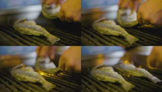 在厨房烹饪烤鱼高清在线视频素材下载