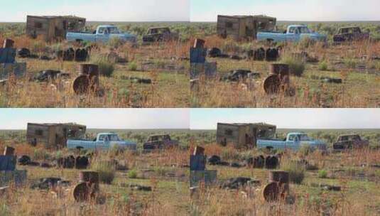 沙漠中废弃的移动房屋和旧卡车轮胎高清在线视频素材下载