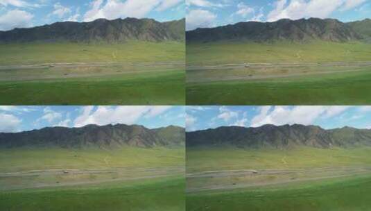 新疆广袤草原上汽车在公路上行驶高清在线视频素材下载