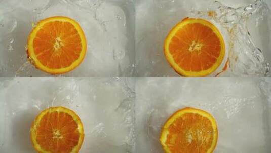 半个橘子在水里漂浮旋转高清在线视频素材下载