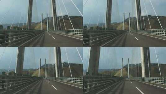 自驾游汽车行驶在果子沟大桥上车内视角拍摄高清在线视频素材下载