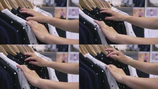 4K升格实拍在商场挑选衣服的女士手部特写高清在线视频素材下载