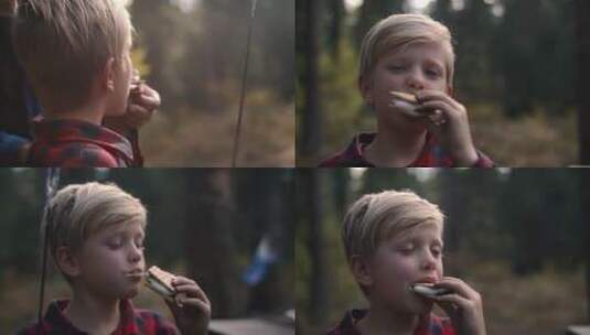 野外吃食物的男孩高清在线视频素材下载