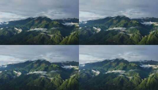 雨雾缭绕、光影斑驳的绿色高山高清在线视频素材下载