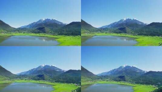 玉龙雪山下的湖泊草原高清在线视频素材下载