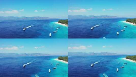 在热带岛屿绿松石泻湖附近的蓝色大海上航行的旅游船，有度假胜地高清在线视频素材下载