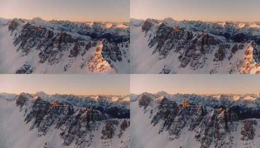 航拍阳光下的雪山日出巍峨山峰高清在线视频素材下载