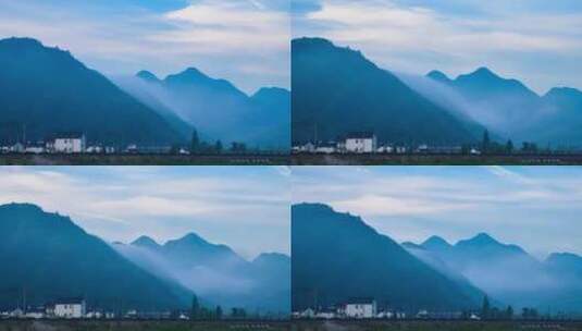 云雾缭绕的高山和美丽乡村延时摄影高清在线视频素材下载
