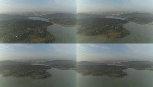 航拍武汉东湖磨山远处城市高清在线视频素材下载