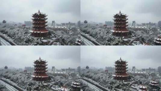 航拍武汉冬天雪景旅游地标黄鹤楼古建筑街景高清在线视频素材下载