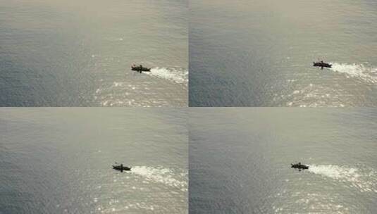 男人划船在波光粼粼的海面高清在线视频素材下载
