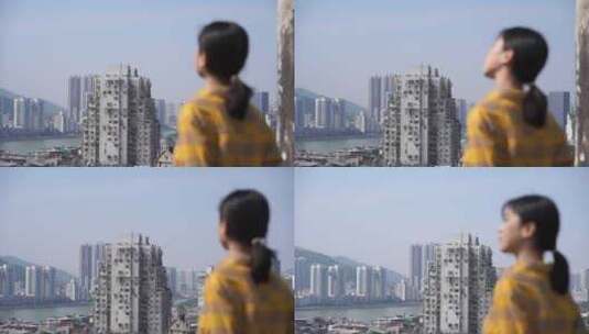 美女游客站在炮台山上看澳门风景看城市风光高清在线视频素材下载