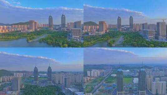 航拍夕阳下的枣庄凤鸣湖双子星大楼高清在线视频素材下载