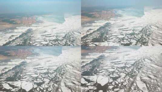 从空中俯瞰冰冻的海洋和城市高清在线视频素材下载