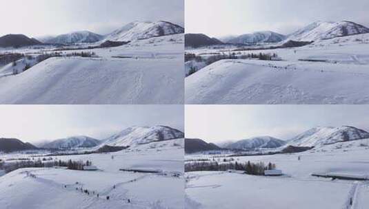 航拍新疆禾木雪景森林雪地小木屋禾木桥雪山高清在线视频素材下载