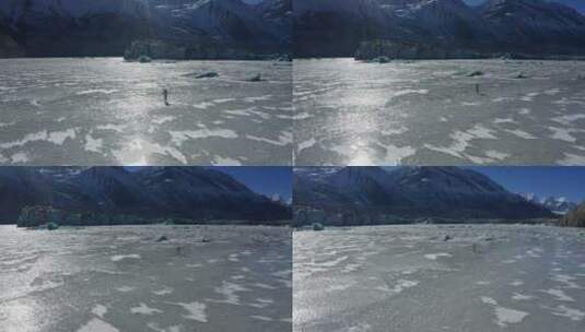 航拍一个人奔跑在来古冰川的冰面上高清在线视频素材下载
