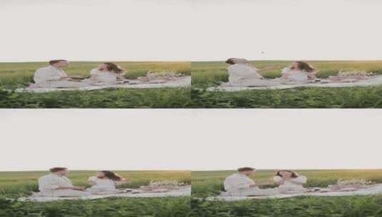 情侣在草地上野餐高清在线视频素材下载