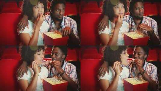 夫妻在电影院吃爆米花看电影高清在线视频素材下载