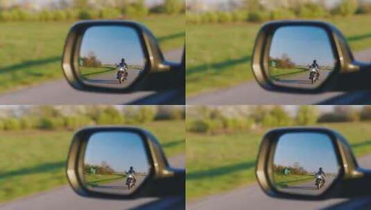 后视镜拍摄的骑机车的人高清在线视频素材下载