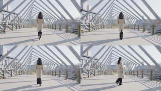 升格行走在桥上的年轻女子高清在线视频素材下载