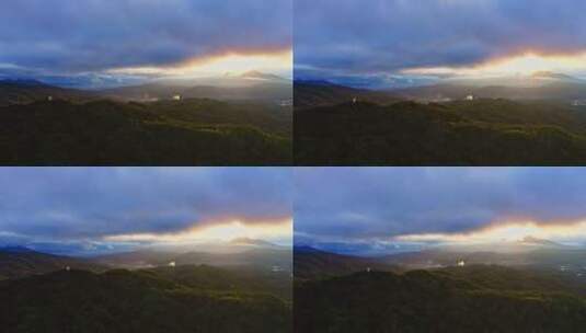 夕阳透过云层染红了山林高清在线视频素材下载