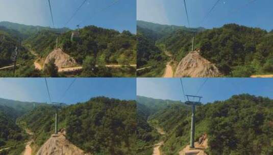 第一视角：缆车上运行在苍翠高山的索道之上高清在线视频素材下载