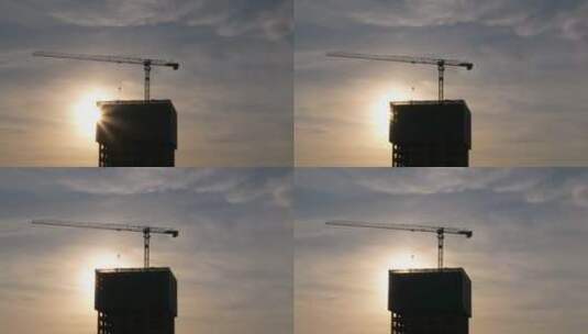 5k黄昏逆光航拍建筑工地塔吊高清在线视频素材下载