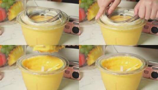 黄色水果奶昔冰激凌放入保鲜盒高清在线视频素材下载